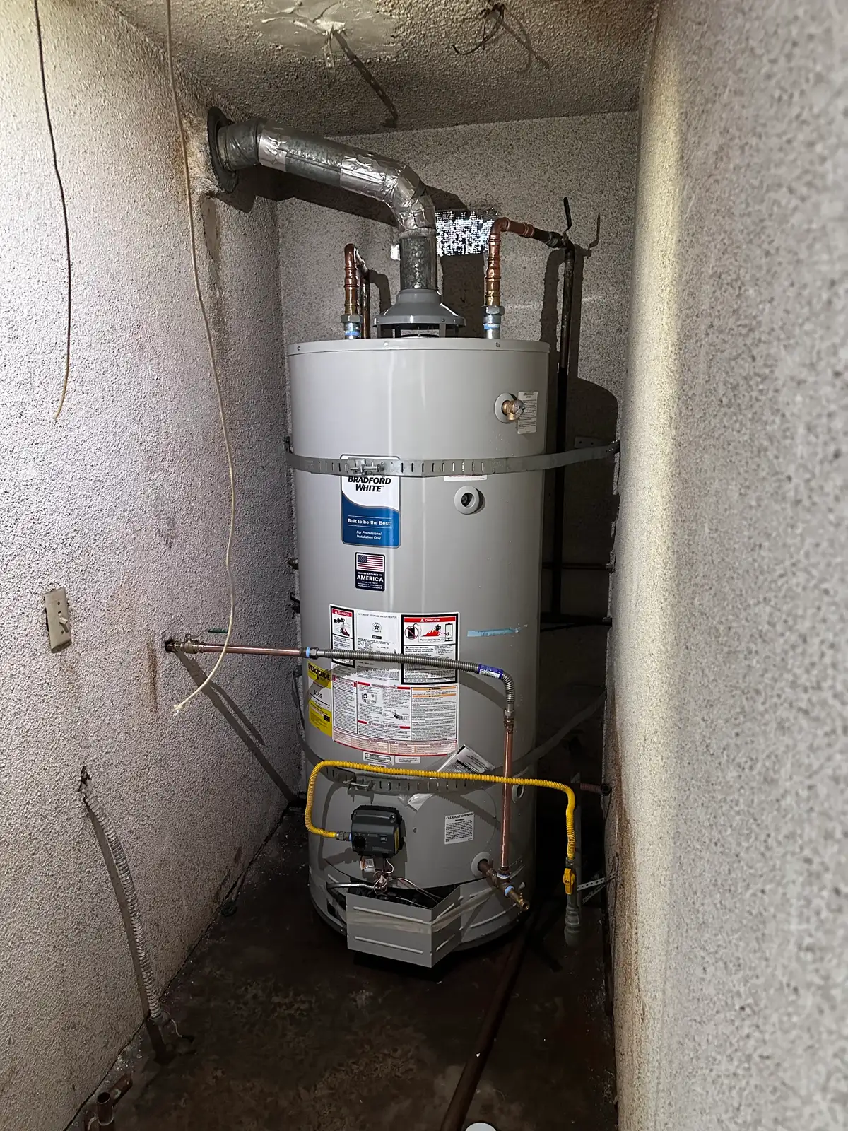 Gas tank water heater in a narrow closet install with overhead venting