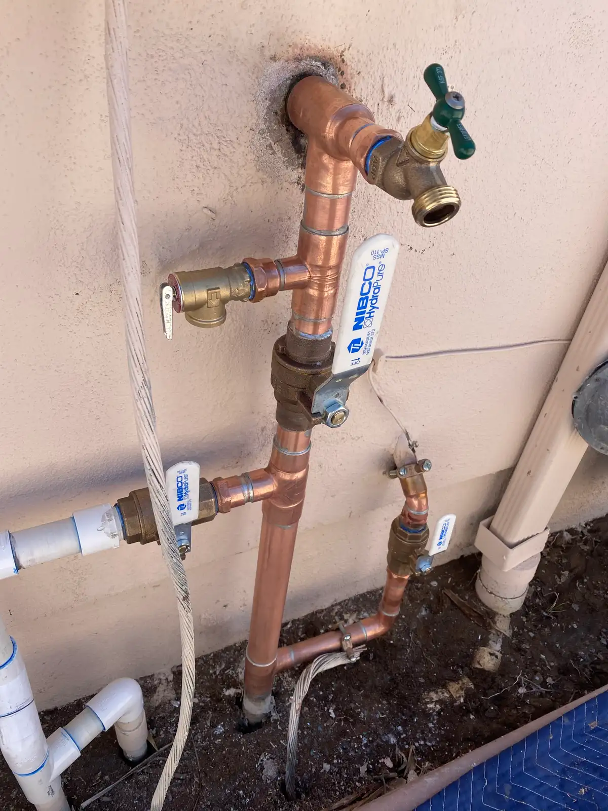 Rerouted supply manifold replacing failed slab-embedded water lines